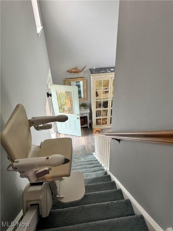 73 Falls River Dr Unit 6, Munroe Falls, OH 44262 - staircase with a high ceiling and wood finished floors