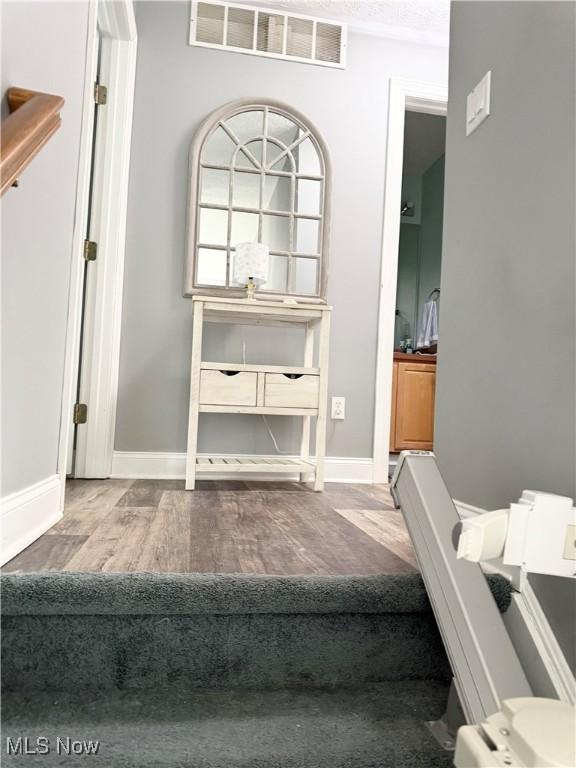 73 Falls River Dr Unit 6, Munroe Falls, OH 44262 - staircase featuring wood finished floors and baseboards