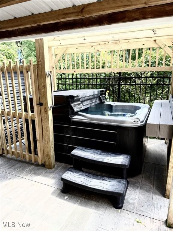 73 Falls River Dr Unit 6, Munroe Falls, OH 44262 - view of patio / terrace with a hot tub