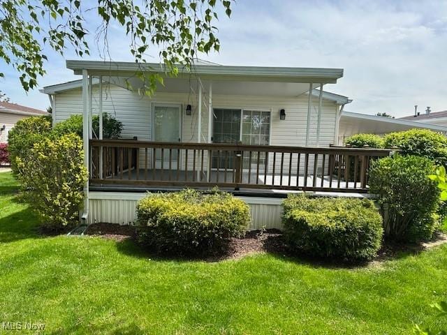 1569 Bogie Ln, Painesville, OH 44077 - rear view of property with a lawn