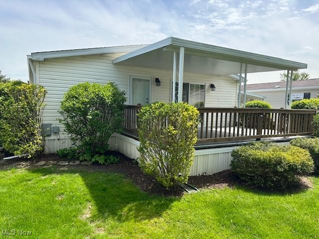 1569 Bogie Ln, Painesville, OH 44077 - view of home's exterior featuring a lawn