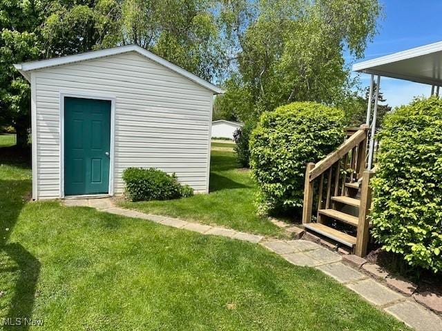 1569 Bogie Ln, Painesville, OH 44077 - view of green lawn with an outdoor structure and stairway