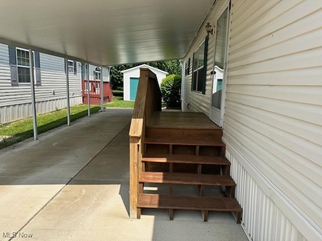 1569 Bogie Ln, Painesville, OH 44077 - view of patio featuring a carport