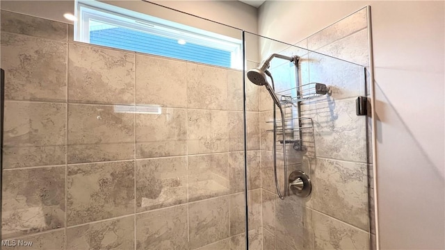 8099 Brookview Ln, Mentor, OH 44060 - bathroom featuring tiled shower and plenty of natural light