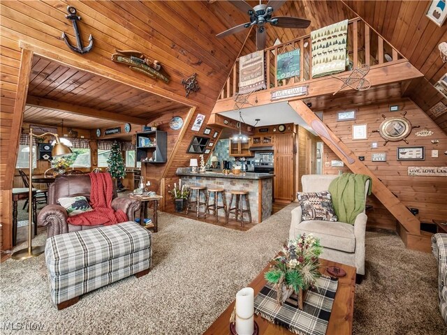 316 Saint Andrews Ln, Senecaville, OH 43780 - living area featuring wooden walls, wooden ceiling, high vaulted ceiling, ceiling fan, and carpet