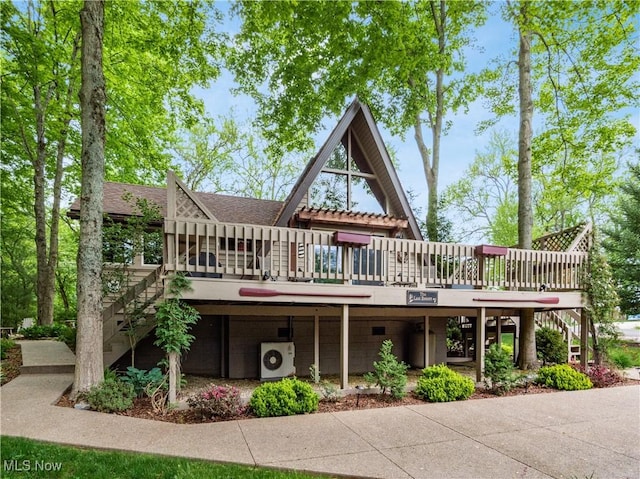 316 Saint Andrews Ln, Senecaville, OH 43780 - view of front of home with stairs, a deck, ac unit, and a shingled roof
