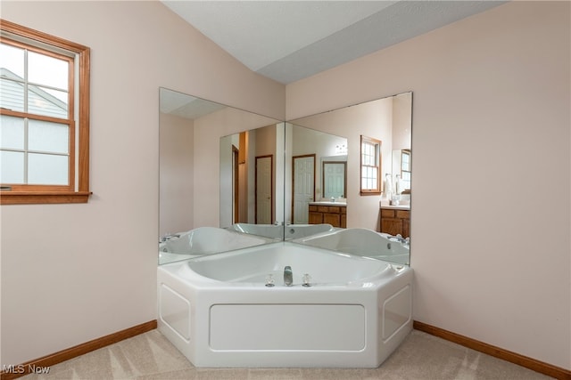 8373 Forest View Dr, Olmsted Falls, OH 44138 - bathroom with baseboards, a bath, and vanity