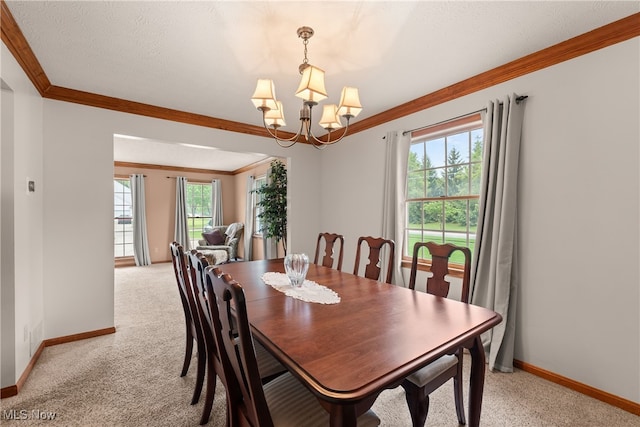 8373 Forest View Dr, Olmsted Falls, OH 44138 - dining area with ornamental molding, baseboards, light colored carpet, and a chandelier