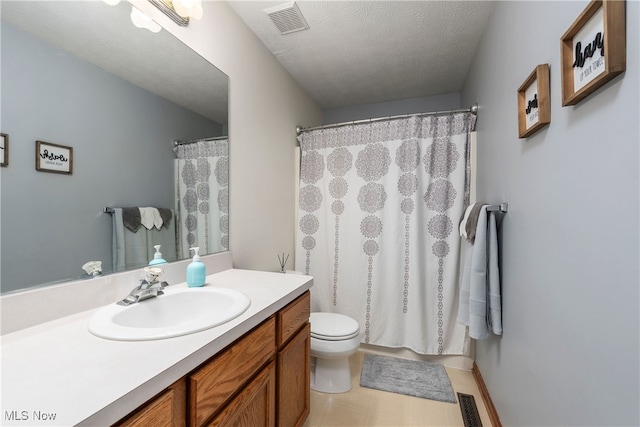8373 Forest View Dr, Olmsted Falls, OH 44138 - full bath with vanity, toilet, and a textured ceiling