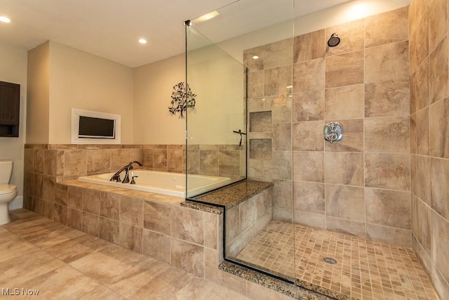 8526 Hoyt Ct, Mentor, OH 44060 - bathroom with toilet, a bath, a tile shower, recessed lighting, and tile patterned floors