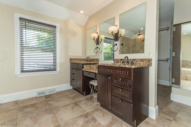 8526 Hoyt Ct, Mentor, OH 44060 - full bathroom featuring vanity, vaulted ceiling, tiled shower, baseboards, and a chandelier