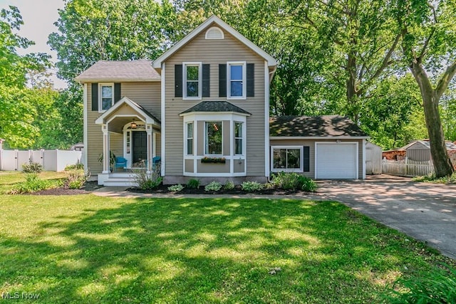 8526 Hoyt Ct, Mentor, OH 44060 - traditional-style home featuring concrete driveway, covered porch, a shingled roof, and a garage