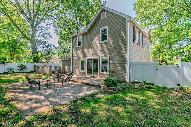 8526 Hoyt Ct, Mentor, OH 44060 - back of house with a gate and a patio area