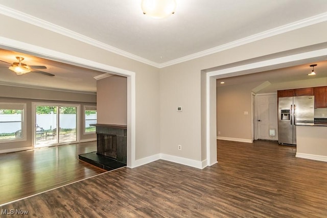 8526 Hoyt Ct, Mentor, OH 44060 - unfurnished living room with dark wood-type flooring, crown molding, a tiled fireplace, baseboards, and ceiling fan