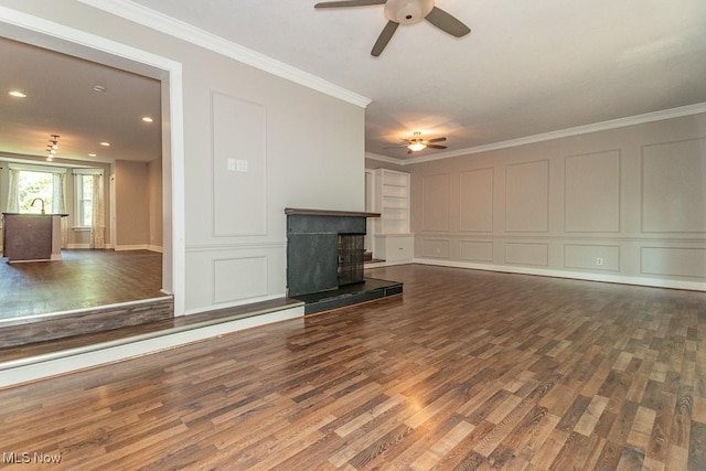 8526 Hoyt Ct, Mentor, OH 44060 - unfurnished living room featuring ceiling fan, wood finished floors, crown molding, a decorative wall, and recessed lighting
