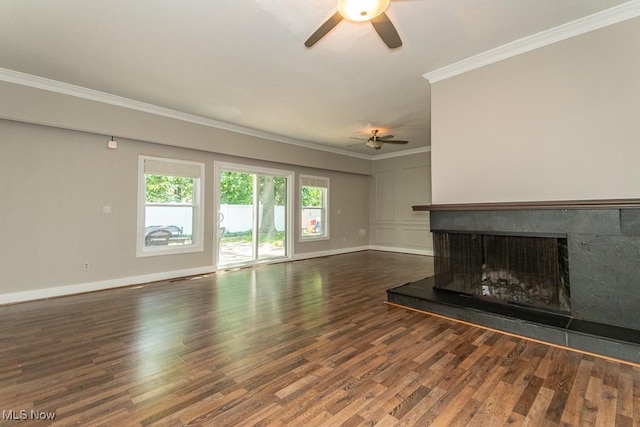 8526 Hoyt Ct, Mentor, OH 44060 - unfurnished living room with a ceiling fan, crown molding, a fireplace with raised hearth, wood finished floors, and baseboards