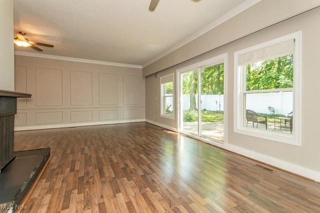 8526 Hoyt Ct, Mentor, OH 44060 - unfurnished living room featuring ceiling fan, wood finished floors, ornamental molding, and baseboards