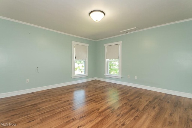 8526 Hoyt Ct, Mentor, OH 44060 - unfurnished room featuring attic access, baseboards, wood finished floors, and ornamental molding