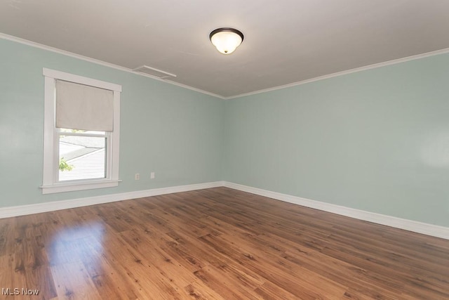 8526 Hoyt Ct, Mentor, OH 44060 - spare room with baseboards, crown molding, and dark wood finished floors