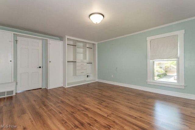 8526 Hoyt Ct, Mentor, OH 44060 - unfurnished bedroom with wood finished floors, crown molding, and baseboards