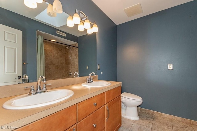 8526 Hoyt Ct, Mentor, OH 44060 - bathroom featuring double vanity, toilet, a shower with shower curtain, baseboards, and tile patterned floors
