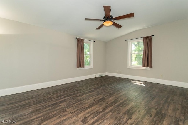 8526 Hoyt Ct, Mentor, OH 44060 - empty room with vaulted ceiling, dark wood-style flooring, plenty of natural light, and ceiling fan