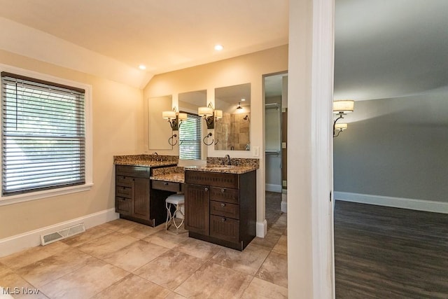 8526 Hoyt Ct, Mentor, OH 44060 - full bath featuring lofted ceiling, vanity, tiled shower, baseboards, and recessed lighting