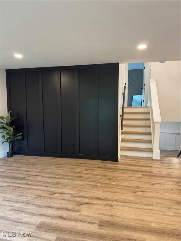 1267 Worton Blvd, Mayfield Heights, OH 44124 - interior space featuring light wood-style floors, a decorative wall, stairs, and recessed lighting