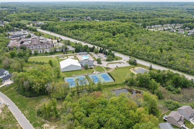 810 Club Dr W, Aurora, OH 44202 - aerial view of property's location with a heavily wooded area and nearby suburban area