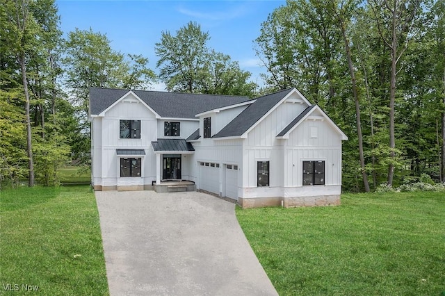 810 Club Dr W, Aurora, OH 44202 - modern farmhouse style home with board and batten siding, a garage, concrete driveway, a standing seam roof, and a shingled roof