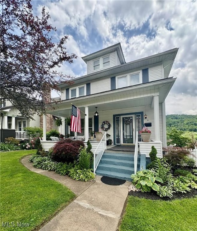 9 Poplar St, Bridgeport, OH 43912 - traditional style home with a porch and a front lawn