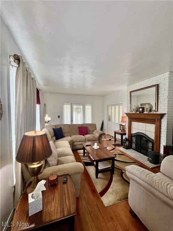 9 Poplar St, Bridgeport, OH 43912 - living room featuring wood finished floors and a tiled fireplace