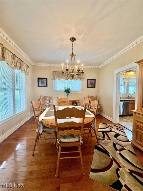 9 Poplar St, Bridgeport, OH 43912 - dining area featuring a chandelier, light wood finished floors, baseboards, and crown molding