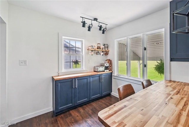 10626 Oakview Dr, Beloit, OH 44609 - dining space with dark wood-style floors and baseboards