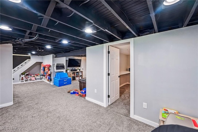 10626 Oakview Dr, Beloit, OH 44609 - finished below grade area featuring baseboards, carpet, and an AC wall unit