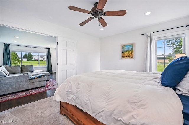 10626 Oakview Dr, Beloit, OH 44609 - bedroom with multiple windows, recessed lighting, wood finished floors, ceiling fan, and access to exterior