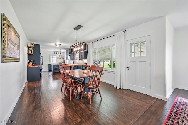 10626 Oakview Dr, Beloit, OH 44609 - dining room featuring dark wood-style flooring and baseboards