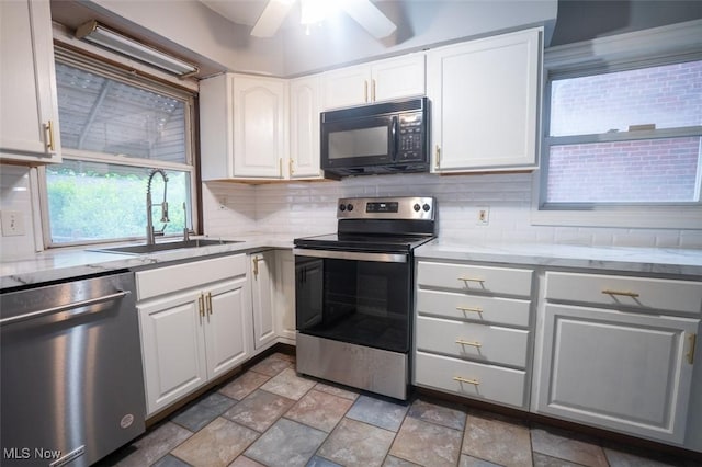 7811 Snow Rd, Parma, OH 44129 - kitchen with stainless steel appliances, a sink, decorative backsplash, and white cabinetry
