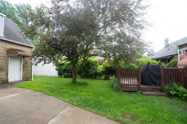 7811 Snow Rd, Parma, OH 44129 - view of grassy yard with a wooden deck