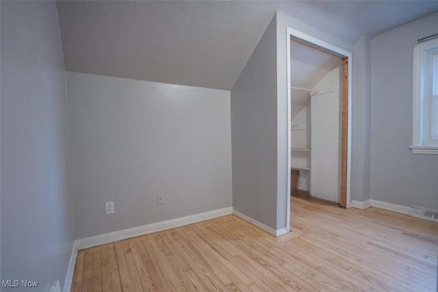 7811 Snow Rd, Parma, OH 44129 - bonus room with vaulted ceiling, wood finished floors, and baseboards