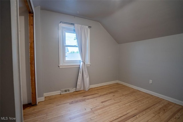 7811 Snow Rd, Parma, OH 44129 - additional living space featuring lofted ceiling, light wood finished floors, and baseboards