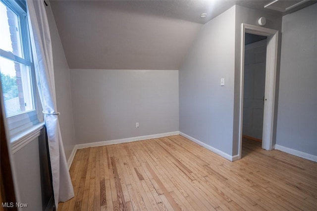 7811 Snow Rd, Parma, OH 44129 - bonus room featuring lofted ceiling, light wood-type flooring, and baseboards