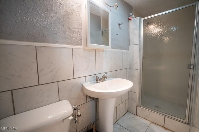 7811 Snow Rd, Parma, OH 44129 - full bath with a shower stall, toilet, tile walls, and marble finish floors