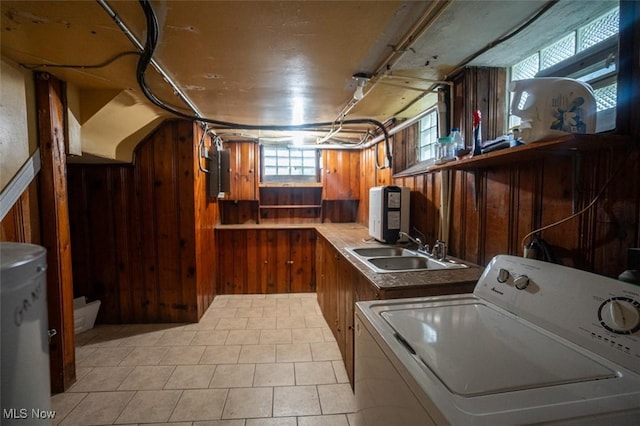 7811 Snow Rd, Parma, OH 44129 - laundry room featuring washer / dryer, wooden walls, and light tile patterned floors