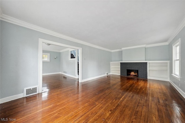 3331 Cedarbrook Rd, Cleveland Heights, OH 44118 - unfurnished living room featuring wood finished floors, ornamental molding, baseboards, and a brick fireplace