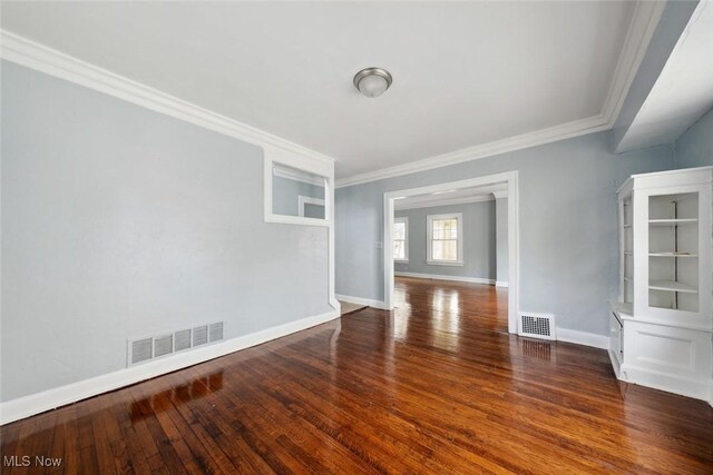 3331 Cedarbrook Rd, Cleveland Heights, OH 44118 - empty room with crown molding, wood finished floors, and baseboards