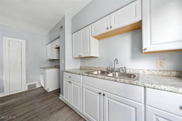 3331 Cedarbrook Rd, Cleveland Heights, OH 44118 - kitchen with a sink, white cabinetry, wood finished floors, and baseboards