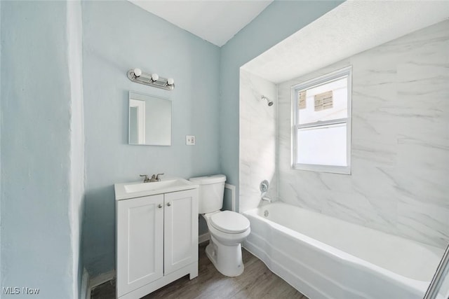 3331 Cedarbrook Rd, Cleveland Heights, OH 44118 - bathroom with toilet, vanity, tub / shower combination, and wood finished floors