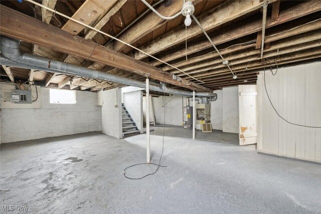 3331 Cedarbrook Rd, Cleveland Heights, OH 44118 - below grade area featuring stairway, gas water heater, and electric panel