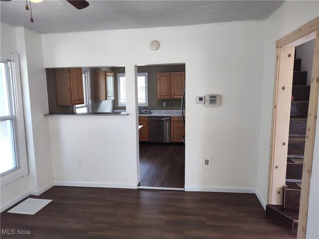 681 Madison St, Conneaut, OH 44030 - kitchen featuring dishwasher, dark wood-type flooring, a ceiling fan, baseboards, and a sink
